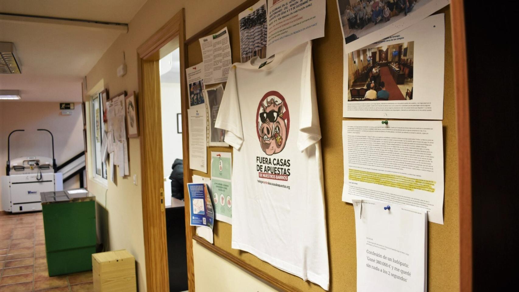 His bulletin board with a t-shirt hanging against the bookmakers.