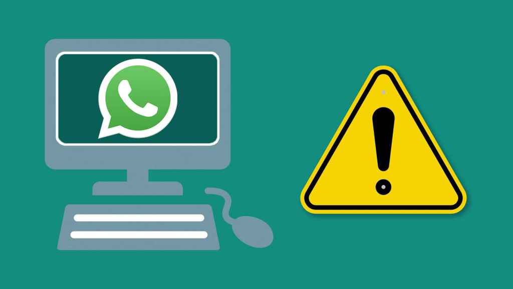 Signo de peligro junto a un ordenador con WhatsApp.