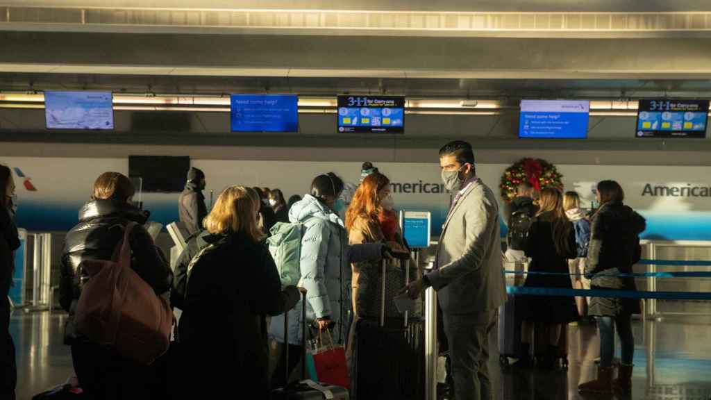 Passengers queuing at JFK Airport in New York.