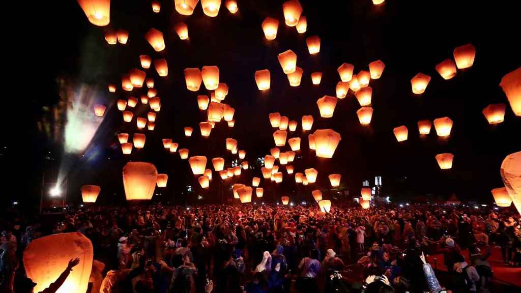 Many people throw lanterns into the sky during the Lantern Festival in Taipei.