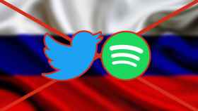 Logos de Twitter y Spotify frente a una bandera rusa.