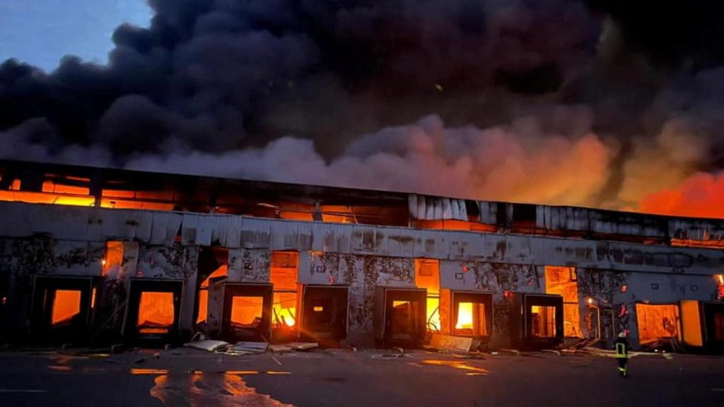A refrigerated cargo warehouse in Kvitnev, Kyiv region of Ukraine, burns after shelling.