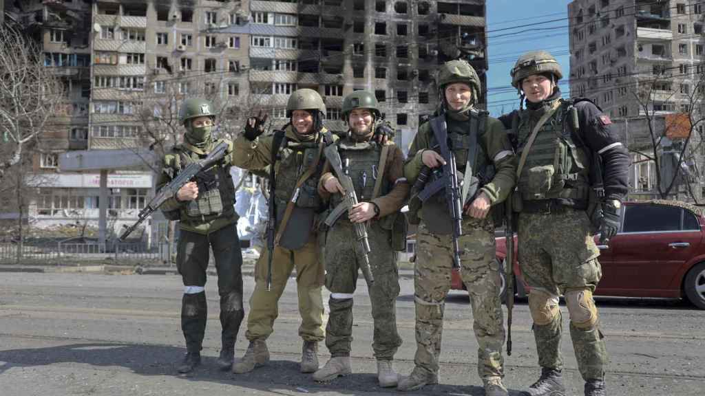Pro-Russian soldiers on the streets of Mariupol.