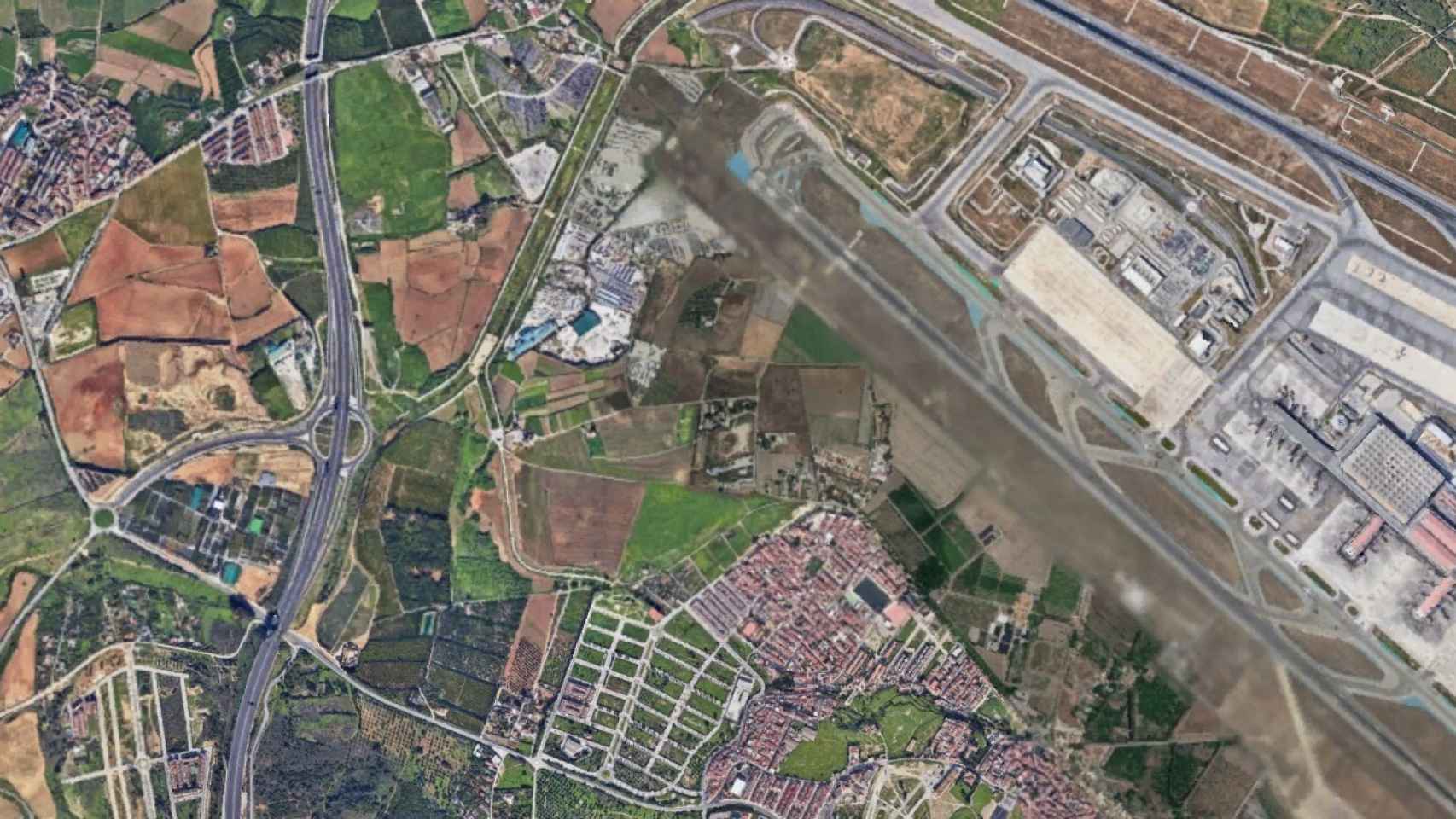 Vista aérea de los terrenos sobre los que se plantea este nuevo parque empresarial en Málaga.