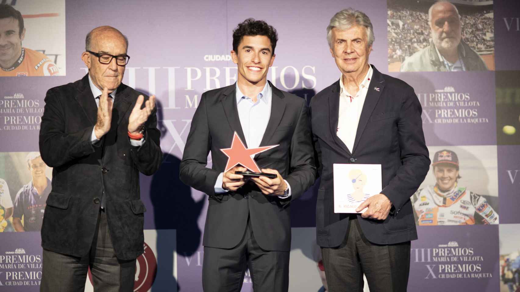 Carmelo Ezpeleta, Marc Márquez y Emilio De Villota, tras recibir el premio María De Villota.
