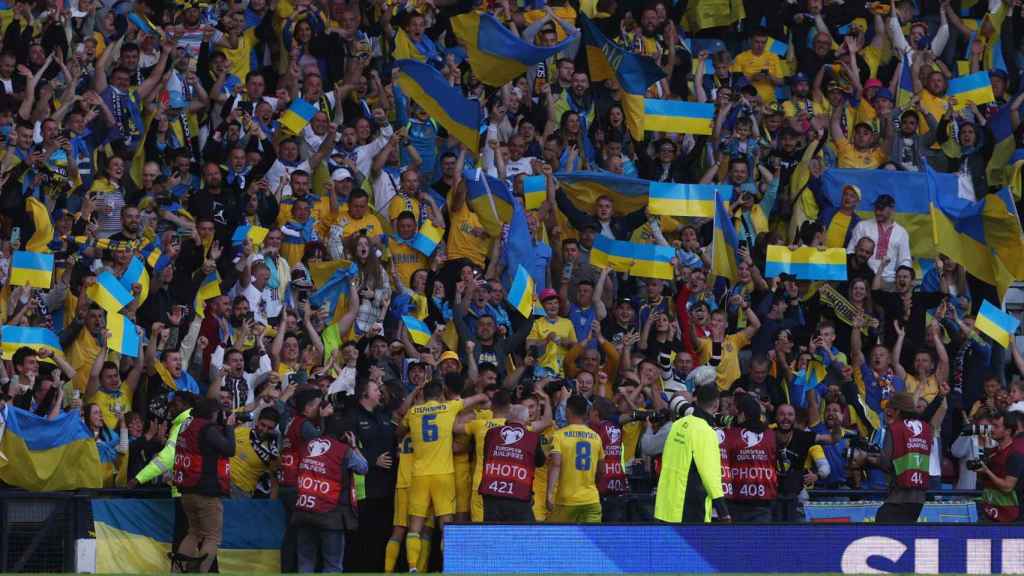 The players of the Ukrainian national team, celebrating a goal with their fans