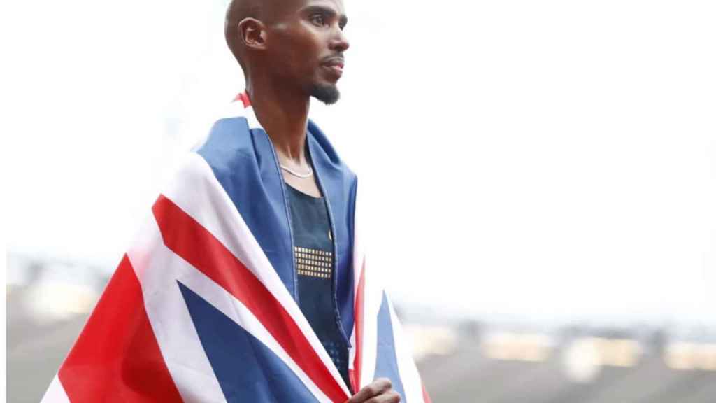 Mo Farah con la bandera británica durante una competición
