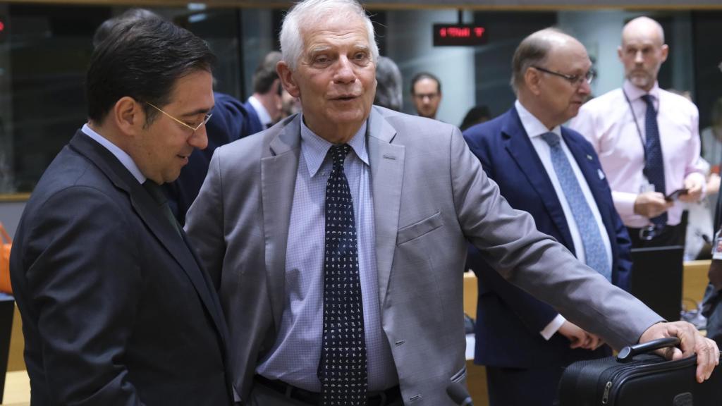 Josep Borrell talks with José Manuel Albares during a meeting of EU Foreign Ministers