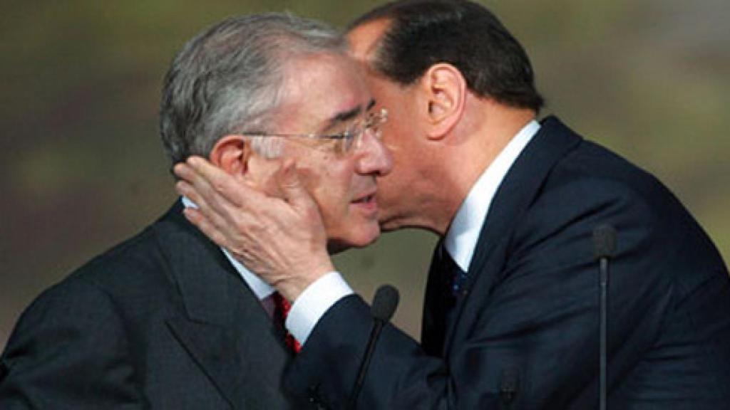 Former Italian Prime Minister Silvio Berlusconi kisses then Senator Marcello dell'Utri.