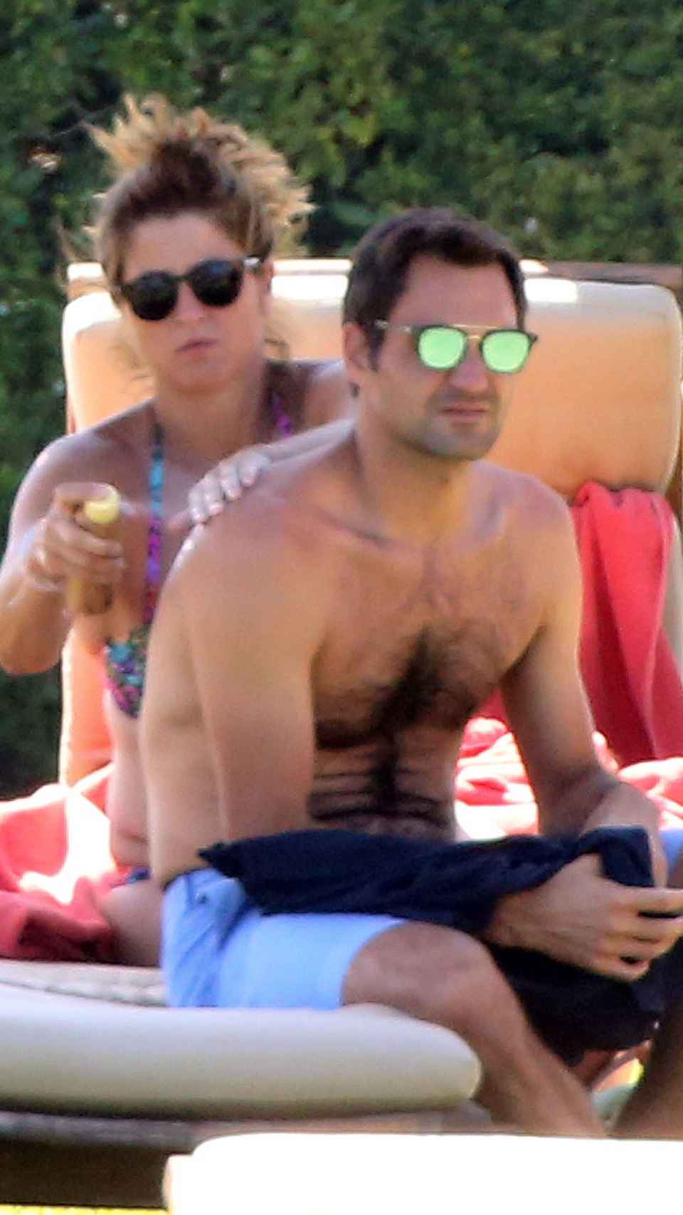The king of tennis with his wife, Mirka Vavrinec, during one of his summer vacations.