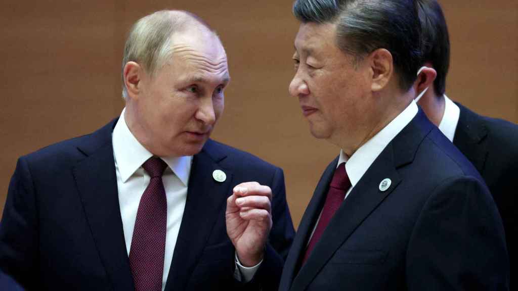 Vladimir Putin with Chinese leader Xi Jinping last September.