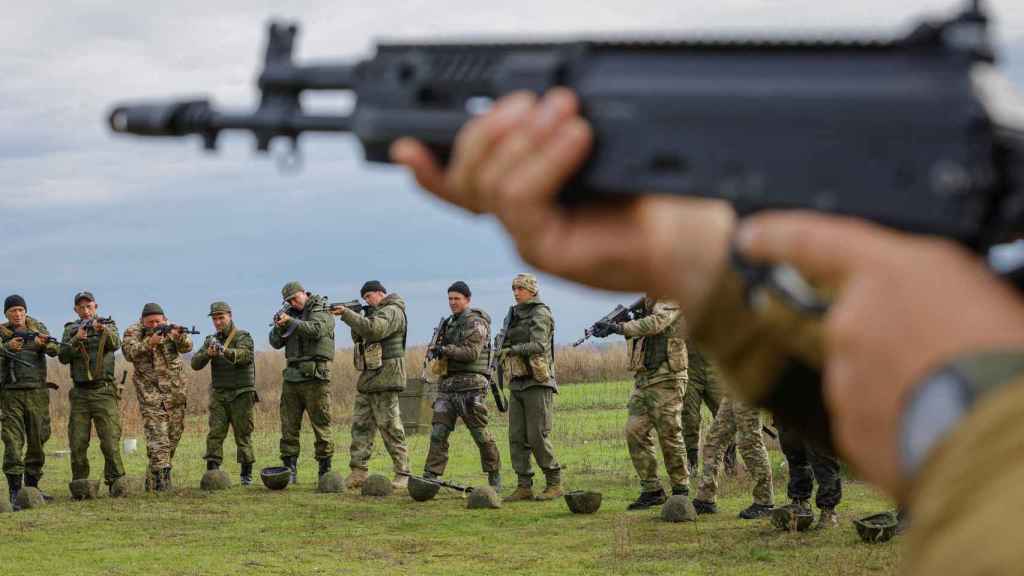 Newly mobilized Russian reservists take part in training at a shooting range in the Donetsk region.