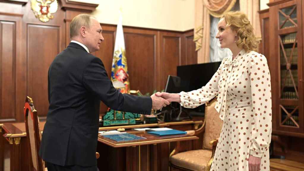 Maria Lvova-Belova and Vladimir Putin.