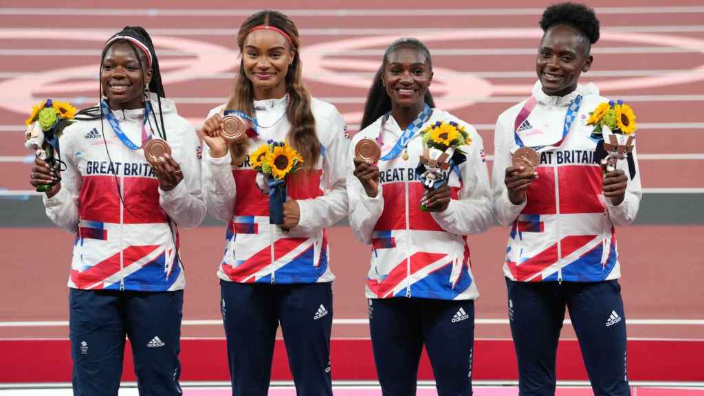 Dina Asher-Smith Imani-Lara Lansiquot, Daryll Neita and Asha Philip celebrate their medals in the 4x100 at the Tokyo Olympics