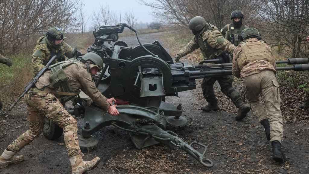 Ukrainian servicemen on the front lines with a ZU-23-2 anti-aircraft gun in the Kharkiv region.