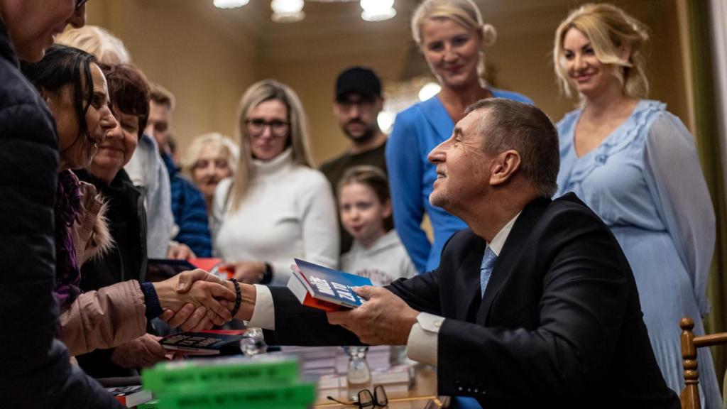 Candidate and former Prime Minister Andrej Babis signs his books for his supporters.