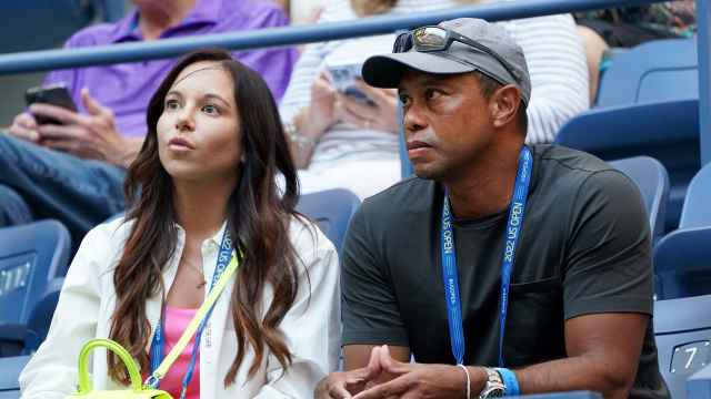 Tiger Woods junto a Erica Herman, su expareja.