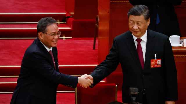 Li Qiang, junto con Xi Jinping