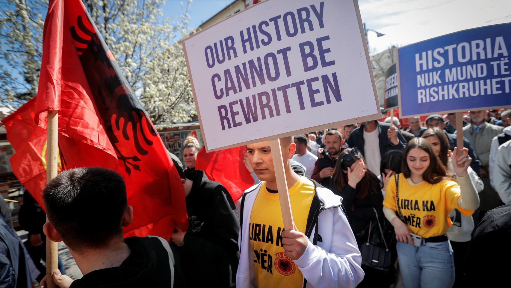 A banner at the Pristina rally reads: History cannot be rewritten.