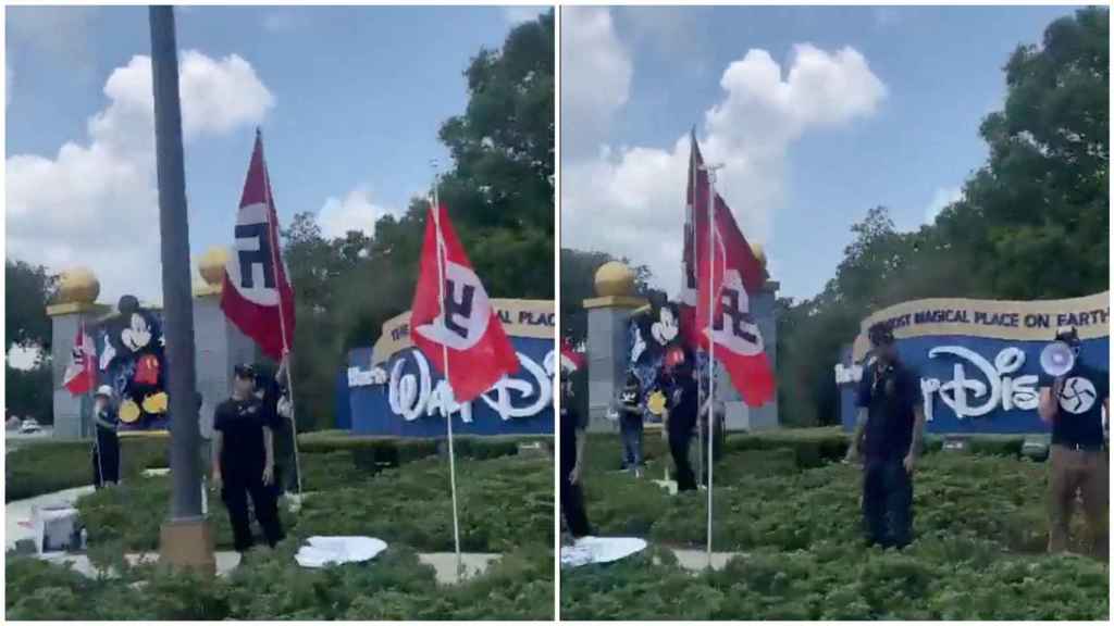 Personas con banderas y símbolos nazis protestan frente al Walt Disney World Resort en Orlando.