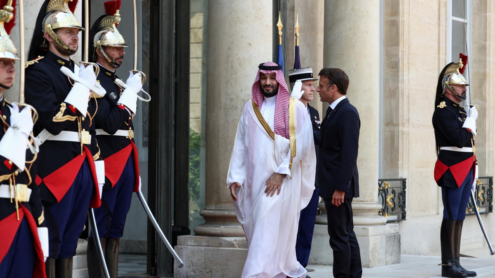 French President Emmanuel Macron welcomes Saudi Crown Prince Mohammed bin Salman.