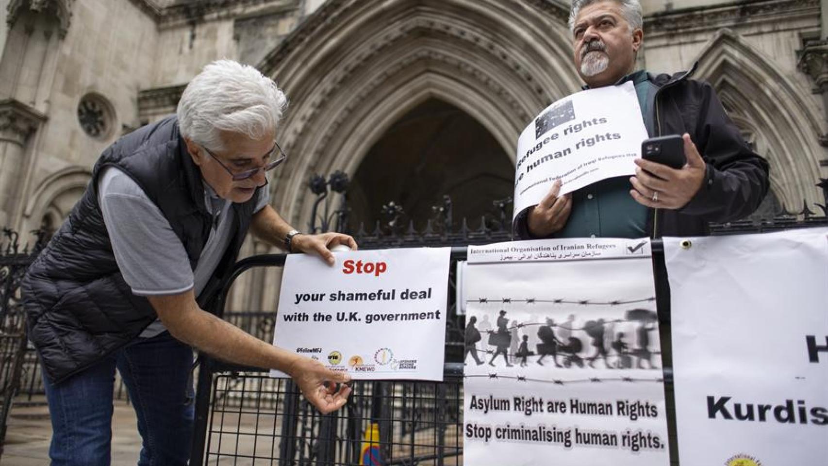 Asylum seekers advocates protest outside the Royal Courts of Justice in London, Britain, on June 29, 2023.