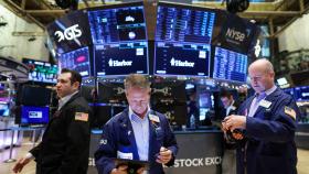 Varios brókeres operan en Wall Street.